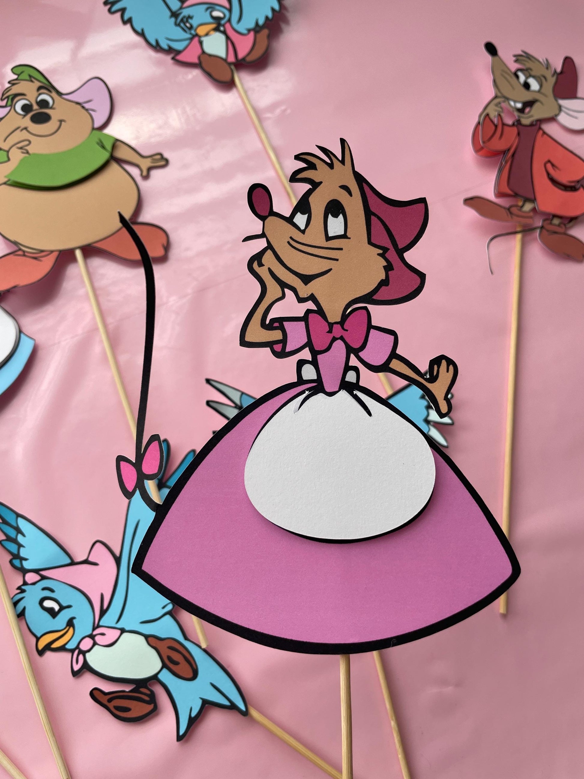 cinderella pink dress mice I was rewatching the scene from Cinderella when the mice and the bluebirds were making Cinderella's pink dress. They measured her skirt, from where her waist would be to where her feet